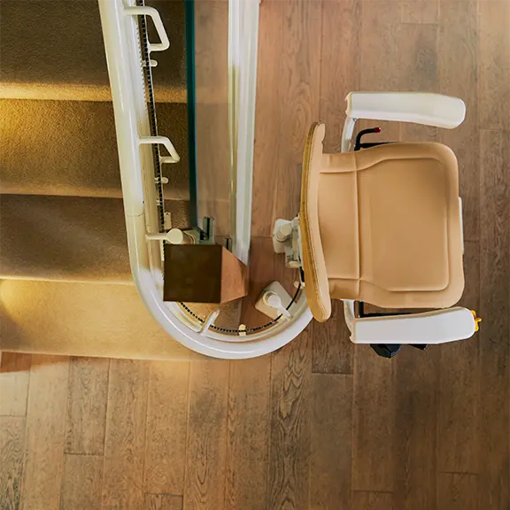 Curved stairlift installed on a staircase with bends