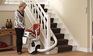 Single rail curved stairlift with dual fold seat and footplate.