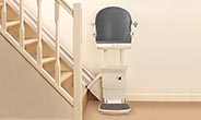 Straight stairlift with a 'Perch Seat' installed on the right.
