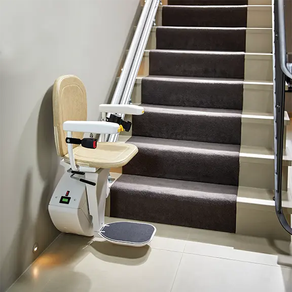 Straight stairlift at the foot of the stairs with Which Stairlift